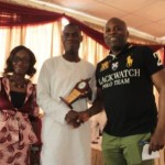 Jarus (m) presenting plaque to Mr. Tope Fasua, FCA, CEO Global Analytics, after his presentation, while Participant Omotola Rashida assists
