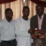 Simon Kolawole (2nd from right) receiving his plaque from Jarus, flanked by Sheriff Kolapo (l) and Sola Fagorusi (r)